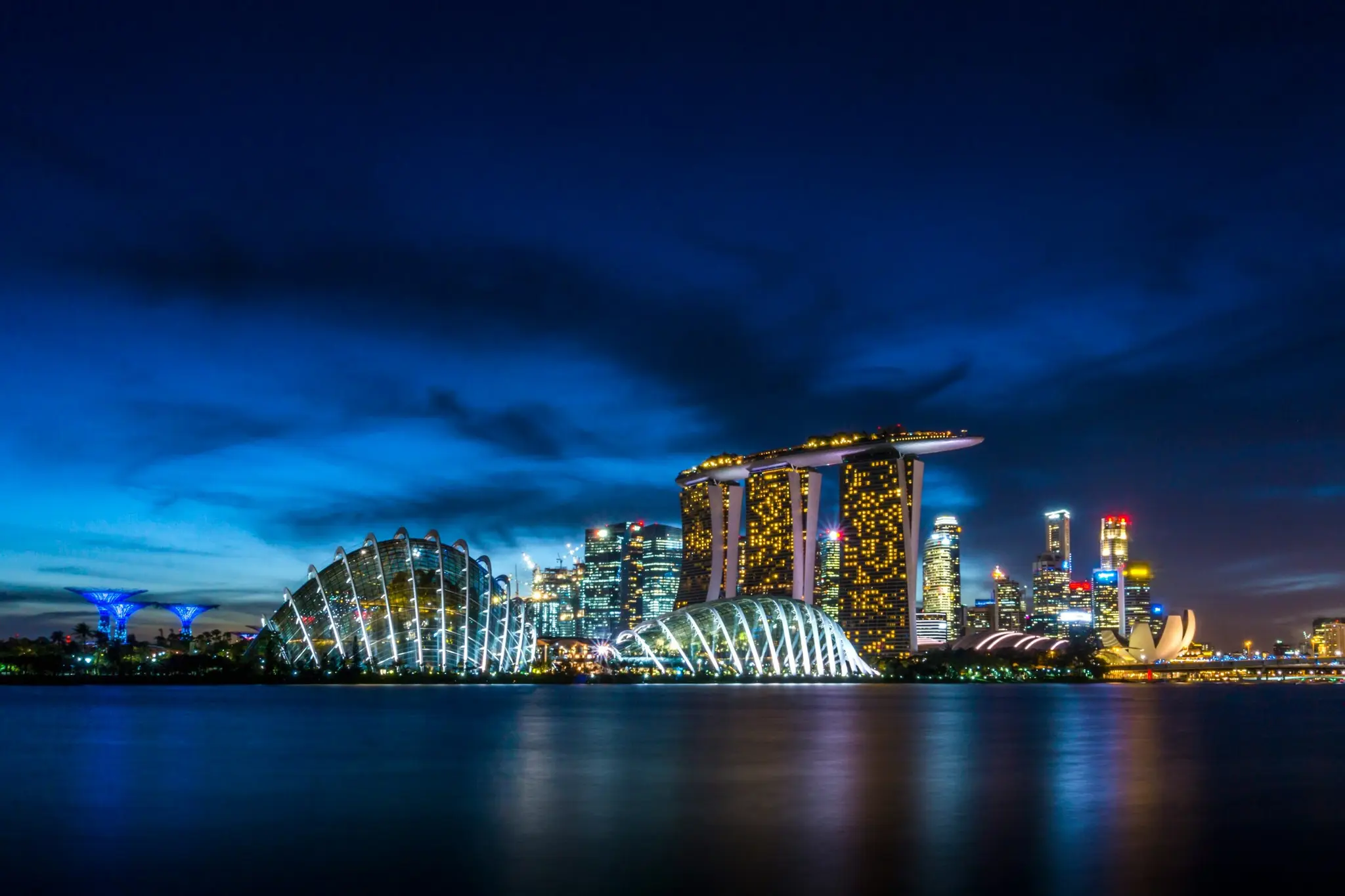Marina Bay Sands and Gardens by the Bay on Singapore’s waterfront at night